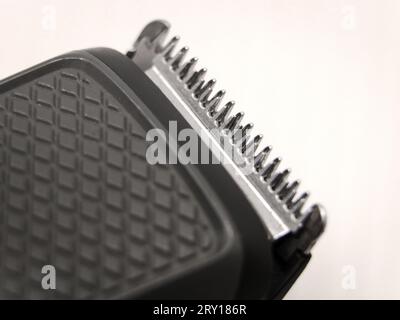 closeup macro shot of the razor teeth of hair clipper or trimmer blade used for shaving isolated in a white background Stock Photo