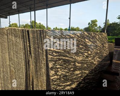closeup of granite stone slabs of mosaic pattern for flooring arranged in the factory storage outlet Stock Photo