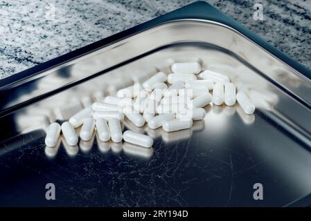 pills and vitamins on a stainless steel tray Stock Photo