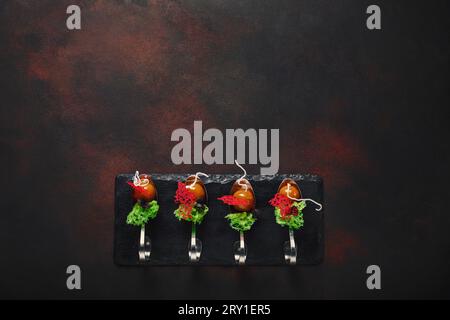 Molecular modern cuisine galantine duck in spoons on stone and rusty background. Top view. Stock Photo