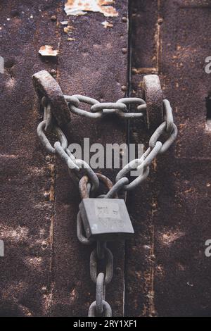 Still life of a padlock on a metal door Stock Photo