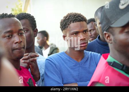 Turin, Italy - September 27, 2023: Migrants arriving from Lampedusa in a Red Cross temporary reception centre Stock Photo