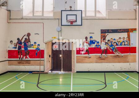 Inside the old prison of Lancaster Castle, Lancashire, UK. The young offender's basketball court decorated by the prison inmates Stock Photo