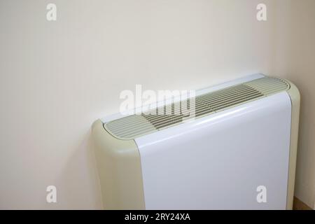 Air conditioner on clear wall for different seasonal climate and energy concepts Stock Photo