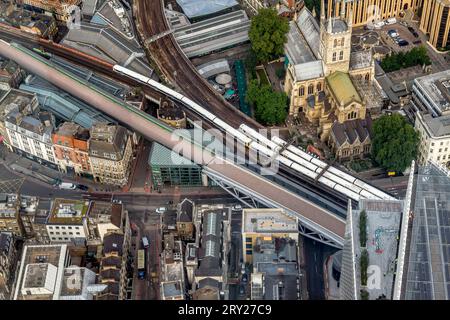 Railway lines threading their way above Borough Market with Southwark Cathedral on the right as seen from the Shard, London Stock Photo