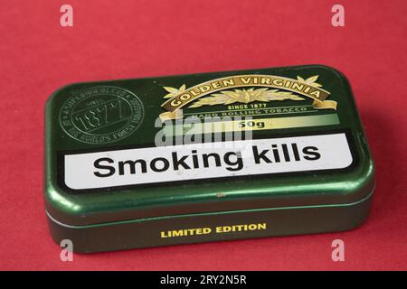 Green 50g tin of Limited Edition Golden Virginia hand rolling tobacco  with larger letters Smoking Kills UK Stock Photo