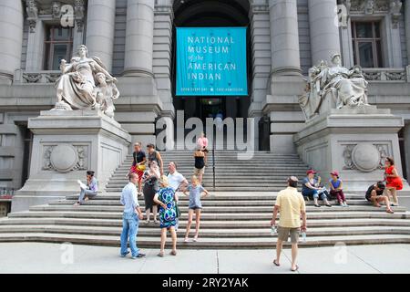 NEW YORK, USA - JULY 4, 2013: People visit National Museum of the American Indian in New York. The museum is one of Smithsonian Institution museums. Stock Photo