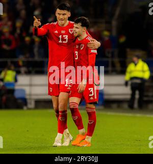 Cardiff, Wales  - 28 March 2023: Wales’ Kieffer Moore and Wales' Neco Williams during the Group D UEFA European Championship Qualifying fixture Wales Stock Photo