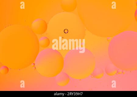 Abstract orange pink background with oil circles water surface Stock Photo