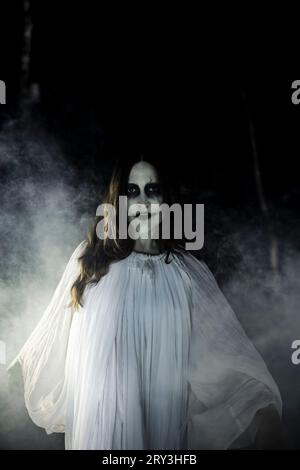 Vertical portrait of a female character in Kecak Fire Dance in Bali ...