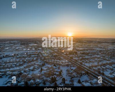 winter sunrise over Fort Collins and plains in northern Colorado, aerial view of residential streets and shopping centers Stock Photo