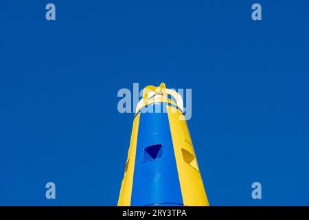 Large sea navigation buoy painted in blue and yellow colors of Ukrainian flag  Stock Photo
