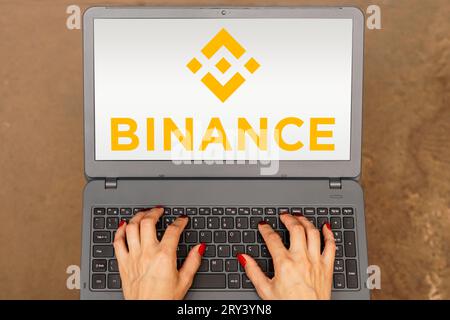 In this photo illustration, the Binance logo is displayed on a laptop screen. Stock Photo