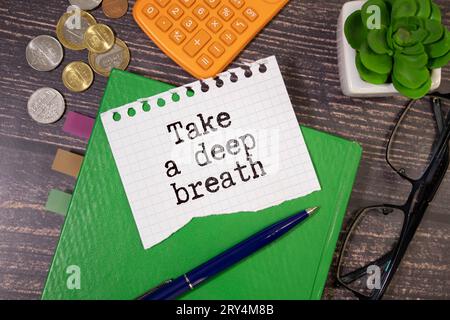 text Take a deep breath on white paper. Stock Photo