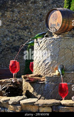 Premium Photo  Decorative fountain in form of pouring wine at the entrance  of milestii mici wine cellars in moldova