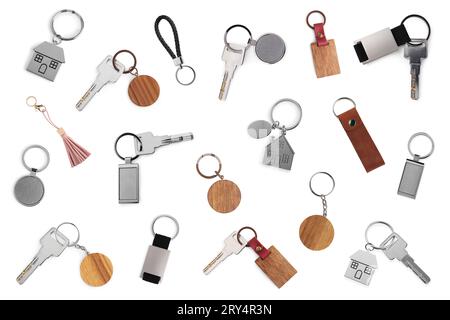 Set with keys and key chains isolated on white Stock Photo