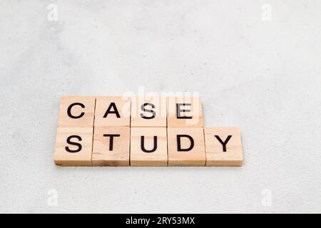 Top view of Case Study word on wooden cube letter block on white background. Business concept Stock Photo