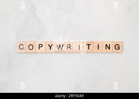 Top view of Copywriting word on wooden cube letter block on white background. Business concept Stock Photo