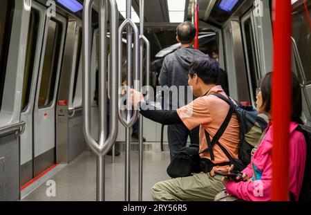 Passengers travelling on the airport rail link. Stock Photo