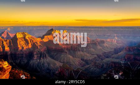 Sunset over the peaks of the Grand Canyon viewed from the terrace of the Lodge on the North Rim of Grand Canyon National Park, Arizona, United States Stock Photo