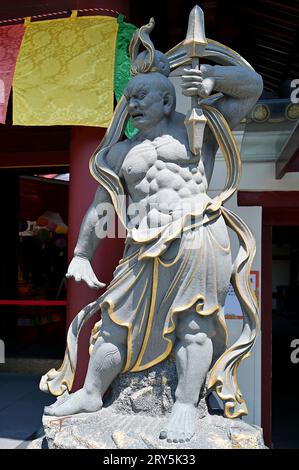 Usually portrayed as a pair of figures that stand guarding temple entrance, nio are two wrathful and muscular guardians of the Buddha standing today a Stock Photo