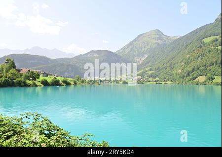There is a wide lake in front of the mountain Stock Photo