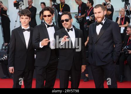 VENICE, ITALY - SEPTEMBER 09:  Agustín Pardella, Juan Antonio Bayona, Enzo Vogrincic and Matias Recalt attends a red carpet at 80th Venice Film Festiv Stock Photo