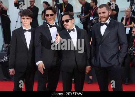 VENICE, ITALY - SEPTEMBER 09:  Agustín Pardella, Juan Antonio Bayona, Enzo Vogrincic and Matias Recalt attends a red carpet at 80th Venice Film Festiv Stock Photo