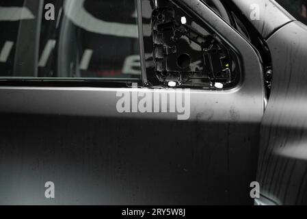 Installation of a protective paint and varnish matte film on the car. The PPF polyurethane film protects the car paint from stones, marks and scratche Stock Photo