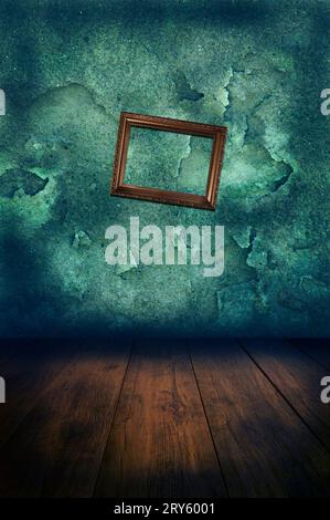 room in decay and an empty picture frame slanted Stock Photo