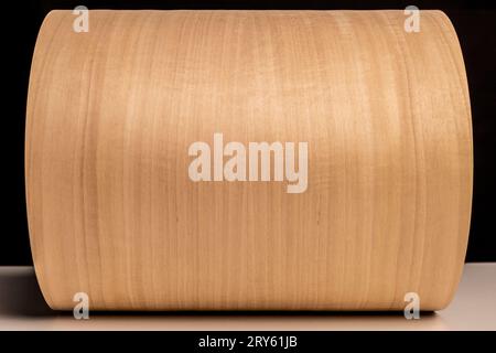 roll of tanganika wood veneer background Stock Photo