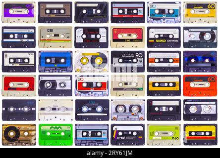 background with audio cassettes of various kinds on a white Stock Photo