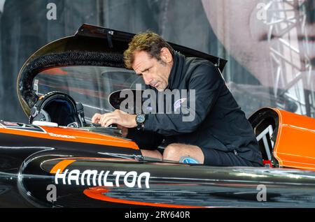Pilot Nicolas Ivanoff in a temporary hangar at Royal Ascot racecourse for the Red Bull Air Race racing series, working on his aircraft Stock Photo
