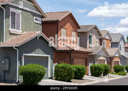 Row of similar houses painted different slightly colors Stock Photo
