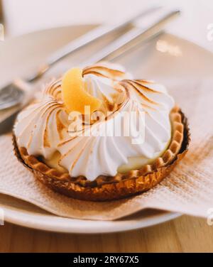 Lemon pie tartlet in a luxury Mediterranean cafe Stock Photo