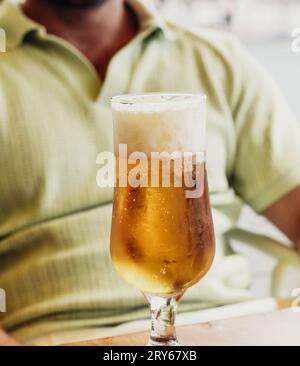 Young adult enjoying a cold beer on a hot summer day Stock Photo