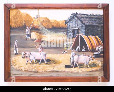 A classic, iconic painting by the artist, Niko Pirosmanashvili, titled, threshing Floor. The painting depicts rural farmers busy threshing wheat with Stock Photo