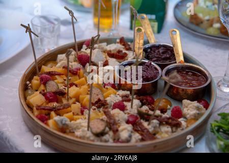 Catering plate. Assortment of snacks on the buffet table. Beautifully decorated catering banquet table with different food snacks and appetizers on co Stock Photo