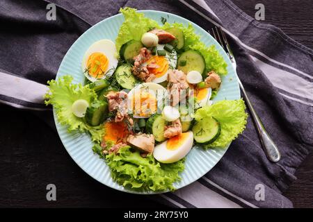 Salad from the liver of codfish, eggs, lettuce Stock Photo
