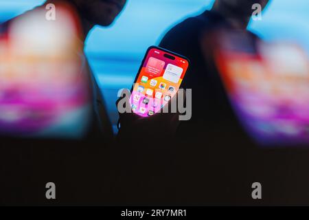 Vilnius, Lithuania - 2023 September 29: Iphone Pro 15 phone. Man holding new Iphone 15 Pro titanium smartphone. High quality photo. Screen of Iphone. Stock Photo