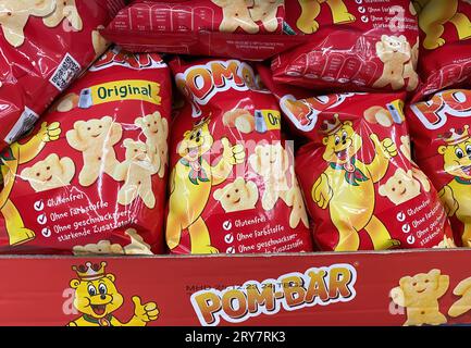 Viersen, Germany - September 9, 2023: Bags Pom-Bear teddy shaped potato chips in shelf of german supermarket Stock Photo