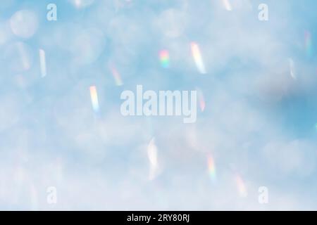 Blue and white snow bubble blurred background. Shining frozen snowy white christmas background Stock Photo