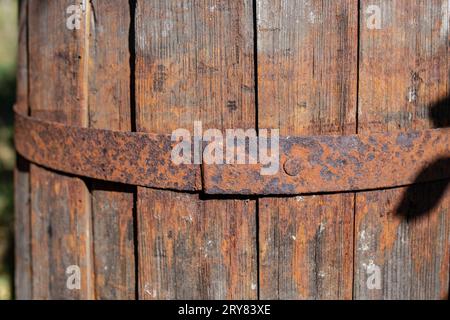 Obsolete wooden barrel with rust pattern, soft focus close up Stock Photo