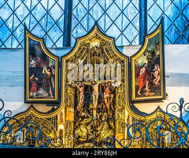 Medieval Crucifixion Triptych Shrine St Mary's Church Gdansk Poland.  Church orginally from 1300s. Rebuilt after war. Stock Photo