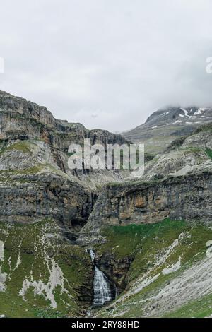 View snowy peaks and waterfall in Ordesa National Park Stock Photo