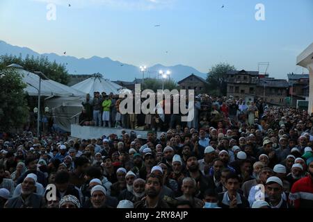 September 29, 2023, Srinagar Kashmir, India : people pray as the head cleric (unseen) displays the holy relic on the occasion of Mawlid-un-Nabi or Prophet Muhammad's (PBUH) birth anniversary in Dargah Hazratbal shrine in Srinagar. Hundreds of thousands of Muslims from all over Kashmir visit the Hazratbal shrine in Srinagar to pay obeisance on the birth anniversary of Prophet Mohammed (PBUH) . The shrine is highly revered by Kashmiri Muslims as it is believed to house a holy relic of the Prophet Mohammed (PBUH). The relic is displayed to the devotees on important Islamic days such as the Mawlid Stock Photo