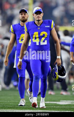 Los Angeles Rams punter Ethan Evans (42) kicks the ball during an NFL  football game against the Seattle Seahawks, Sunday, Sept. 10, 2023 in  Seattle. The Rams won 30-13. (AP Photo/Ben VanHouten