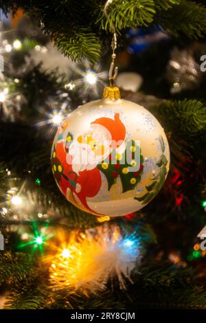 Close up of a painted Christmas bauble hanging on the Christmas tree Stock Photo