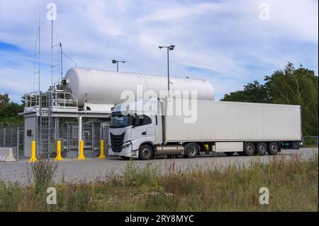 A truck at an LNG filling station Stock Photo