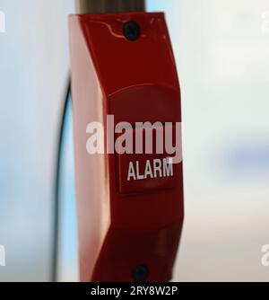 red alarm button to press during emergency situations in the keypad Stock Photo